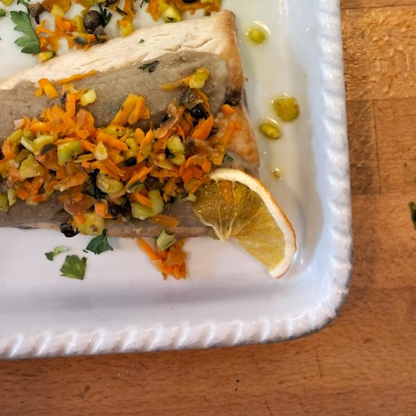 Trancio di capone con crema di melanzane, carote, capperi e sadano